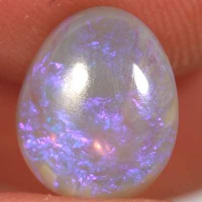 SOLID CRYSTAL OPAL Sparkles of purple over a mauve hue